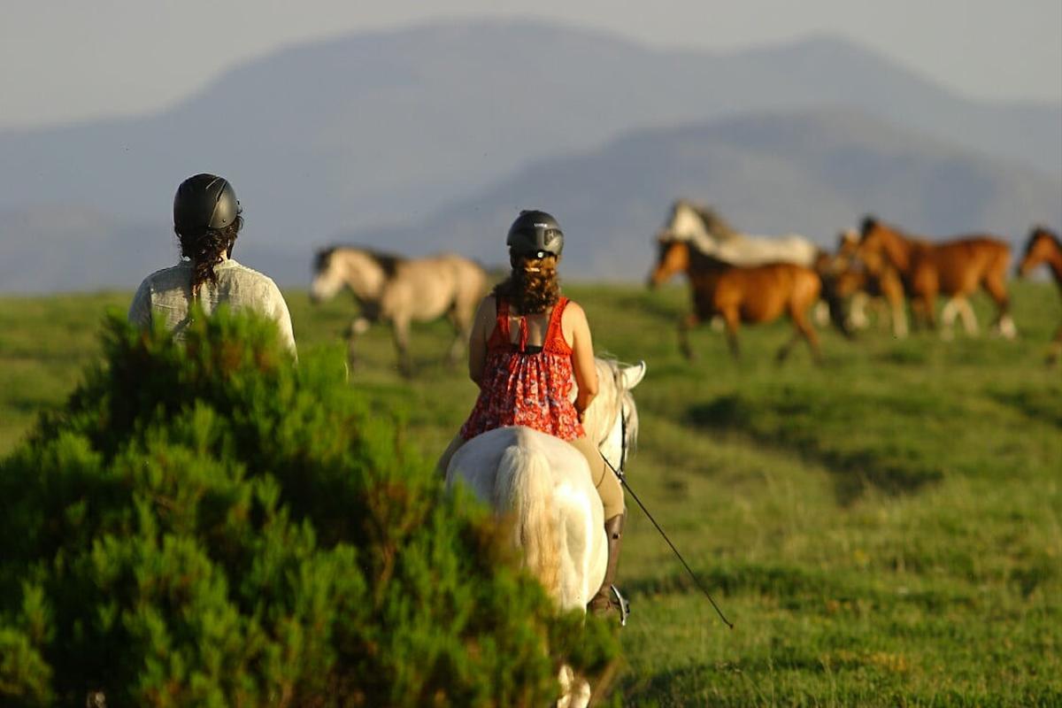 Girls riding horses explore Peneda-Gerês National Park